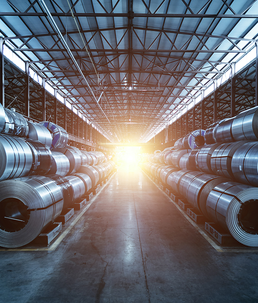 Steel rolls in a modern metal and mining infrastructure facility – AM Associates India, leaders
in steel manufacturing and industrial steel solutions.